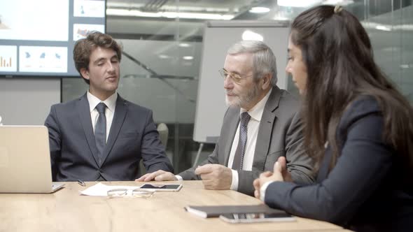 Thoughtful Business Team Brainstorming in Conference Room