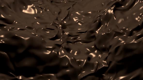 Flowing Stream of Melted Liquid Chocolate