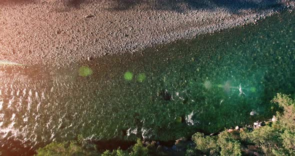 Mid Air Flight Over Fresh and Clean Mountain River at Sunny Summer Morning