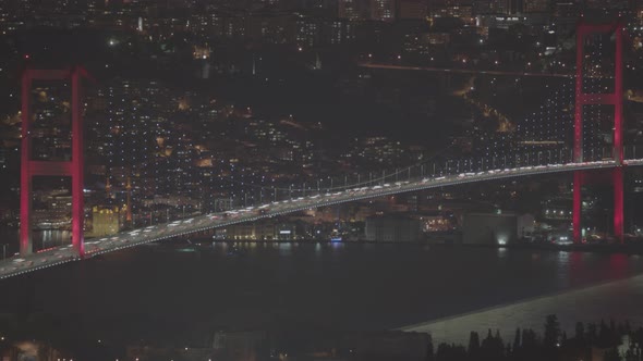Aerial Night view of Istanbul, Bosphorus with illuminated Bridges. Cinematic panorama.