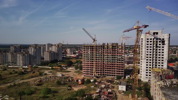 Modern Building Under Construction with Crane. Constructing Building with High Crane