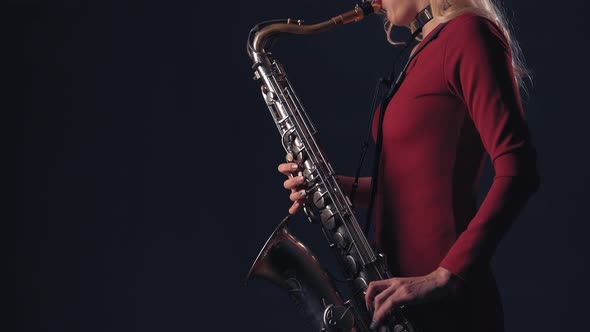 Woman Plays On Saxophone Jazz Melody