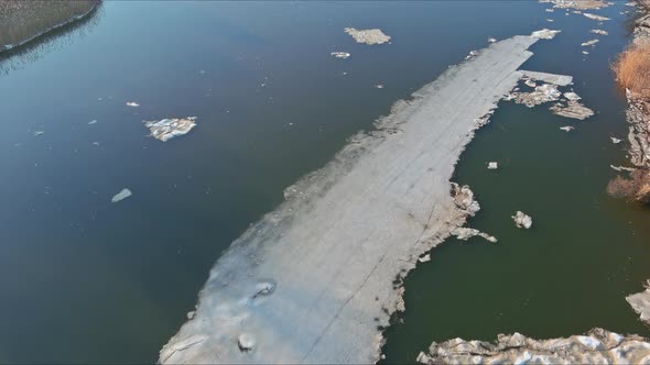 Early Spring Breaking Ice Flows Large and Small Breaking on the River