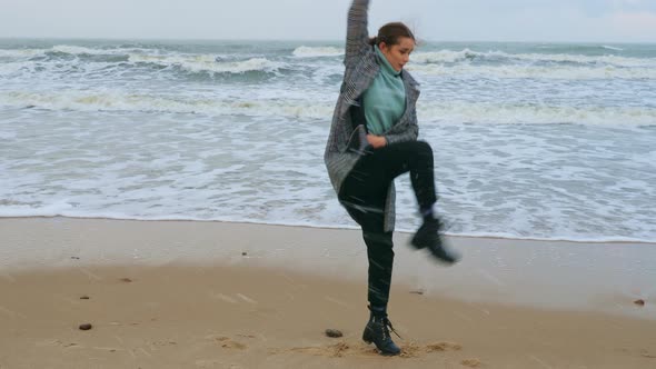 A Woman Performing Dance Improvisation at the Seacoast