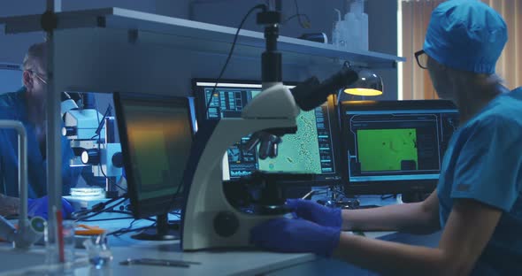 Scientist Using a Microscope in a Lab