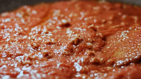 In a Frying Pan with Vegetable Oil Fry Minced Meat Onions and Carrots with Tomato Paste