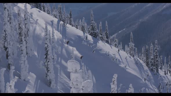 Downhill Skiers Dual Run On Steep Ridge