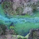 Aerial drone view of a beautiful natural spring on a sunny day - VideoHive Item for Sale