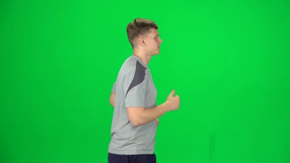 Young Man Running, Chroma Key. Side View. Slow Motion