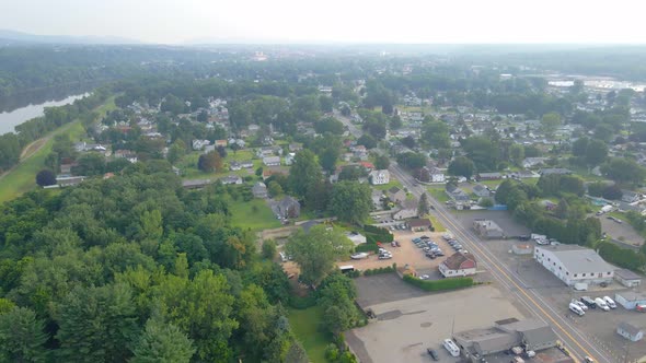 Aerial fly-over a suburban downtown outskirt are in America