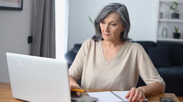 Middleaged Woman Using Laptop