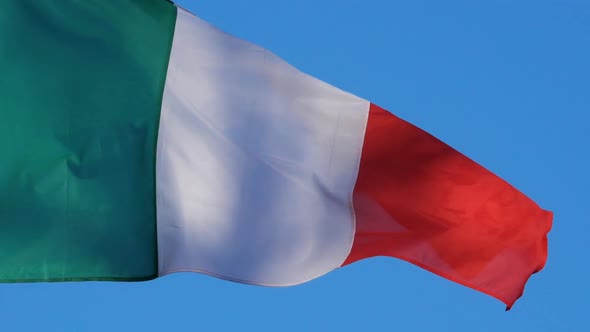 The national italian flag waving in the wind.