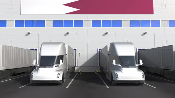 Modern Trucks at Warehouse Loading Bay with Flag of QATAR