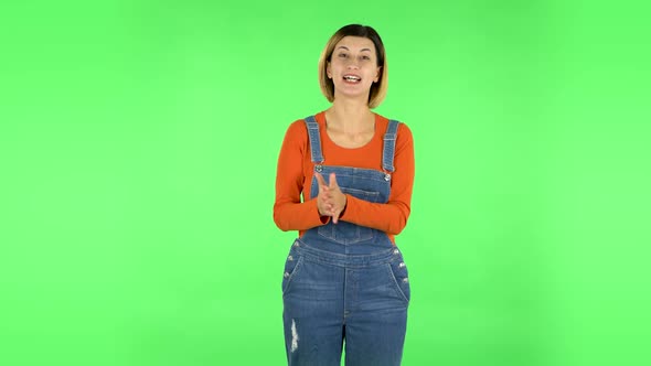 Beautiful Girl Is Reporting and Tells a Lot of Interesting Informations. Green Screen