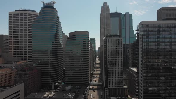 Aerial footage, downtown Minneapolis on a sunny afternoon, camera approaching to buildings