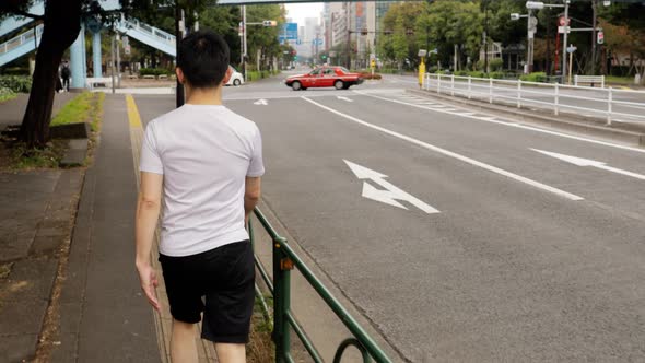 Middle-aged Japanese man exercises in Tokyo Japan