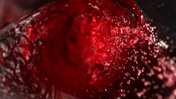 Super Slow Motion Abstract Shot of Red Wine Pouring in Glass Bottle at 1000 Fps