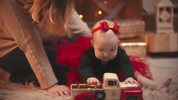 Baby  Playing with a Toy Car