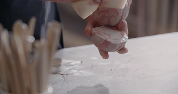 Ceramist Kneads a Colored Piece of Clay to Make a Narikomi Pottery at the Workshop Potter at Work