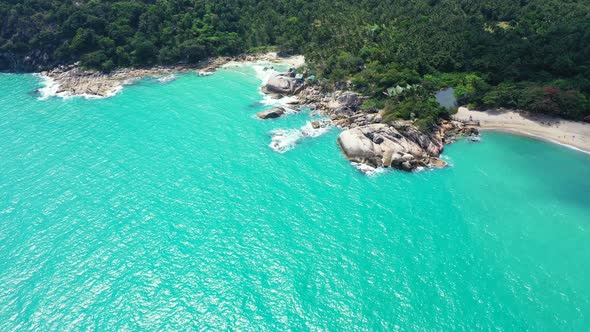 Haad Thong Reng, Koh Phangan, Thailand. Small secluded sandy beach surrounded by tropical jungle.