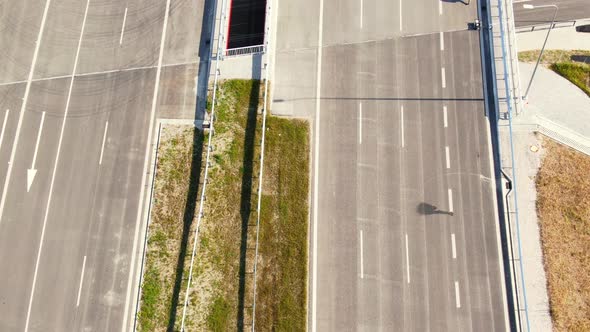 Drone shot highway motorway showing lanes with Tunnel and viaducts outside the city of Warsaw, Polan