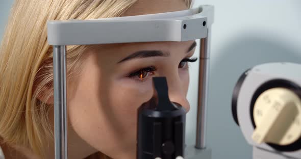Young Woman Having Her Eyes Examined With Modern Medical Equipment Vitiligo 
