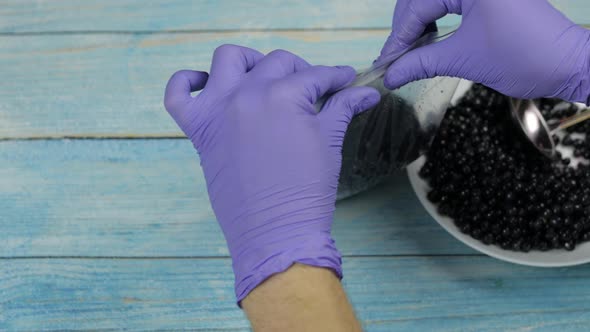 Packing Blueberries in Zipper Plastic Bags for Freezing. Frozen, Preservation Fruits, Berries Food