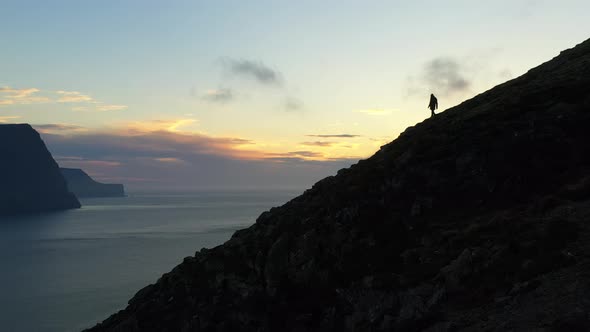 Drone Over Man At Sunset On Mount Villingadalsfjall