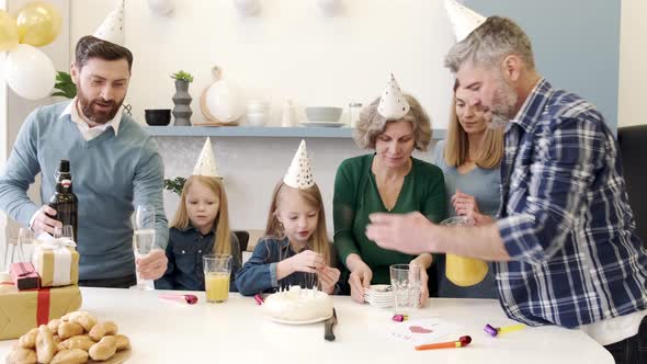 Family Celebrating Birthday in the Kitchen Together