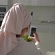 A Young Woman Watching your Smartphone at Home - VideoHive Item for Sale