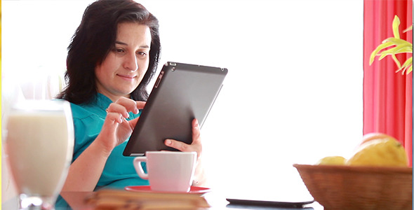 Woman Working on Digital Tablet Computer