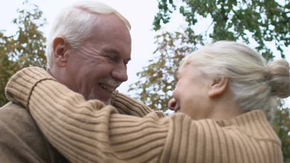 Joyful Mature Couple Looking Each Other, Romantic Husband and Wife Outdoors