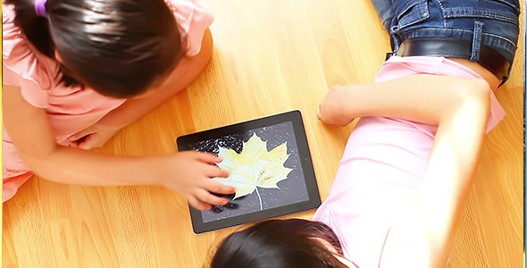 Teenage Girls with Digital Tablet Computer