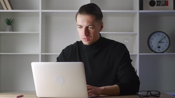 Focused Business Man Entrepreneur Working at Laptop
