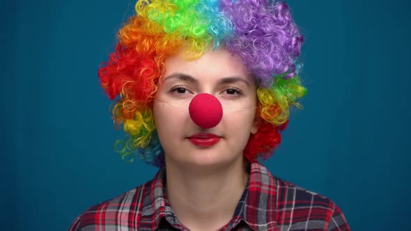 Portrait of a Clown on a Blue Background