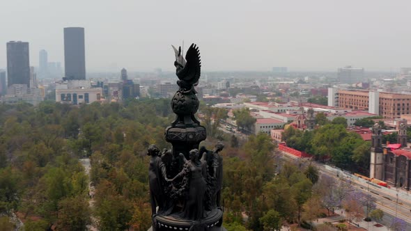 Drone Flying Around Statues on Memorial Located on High Pillar