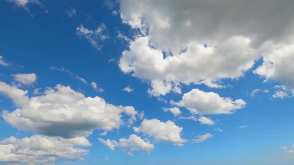 4K Sky Time lapse, Beautiful background, Sky Timelapse of skyscrapers, Blue sky with clouds and sun.