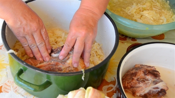 Woman's Hands Preparing Stuffed Cabbage 01