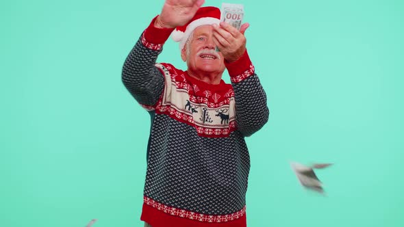 Rich Senior Man Winner in Christmas Red Sweater Showing Wasting Throwing Money Around Shopping
