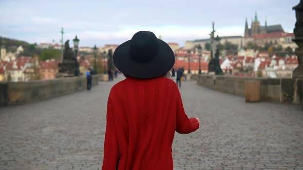 Girl Wearing Hat and Red Jacket Enjoying the City During Her Vacation