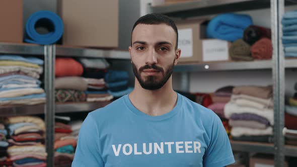 Portrait View of the Caucasian Volunteer Man Looking at the Camera with Smile