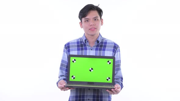 Stressed Young Asian Hipster Man Showing Laptop