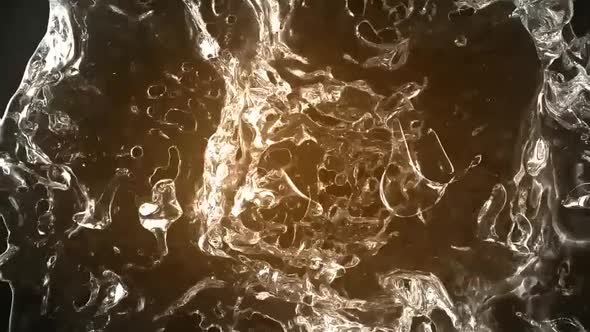 Collision Of Two Golden Color Water Streams alt