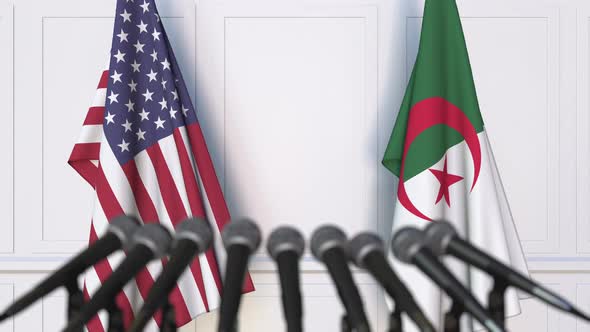 Flags of the USA and Algeria at International Meeting or Conference