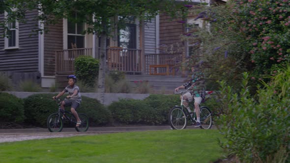 Senior man and grandson riding bicycles together