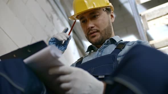 Asian Construction Worker with Clipboard alt
