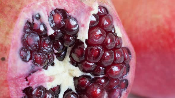 Lythraceae family pomegranate fruit with seeds 4K 3840X2160 UHD tilting video - Halved red healthy P