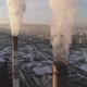 Aerial view of smoke rising from the chimney of a coal boiler. Slow motion, top view - VideoHive Item for Sale