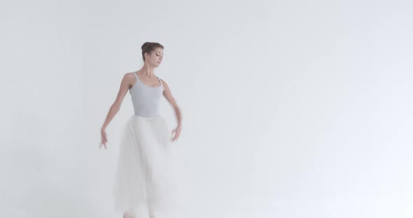 Dramatic Dance Elegant Female in a White Tutu Dance Ballet and Perform Choreographic Elements