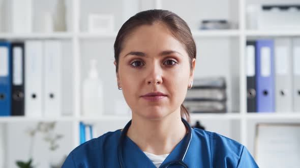 Professional medical doctor working in hospital office. Young and attractive female physician.